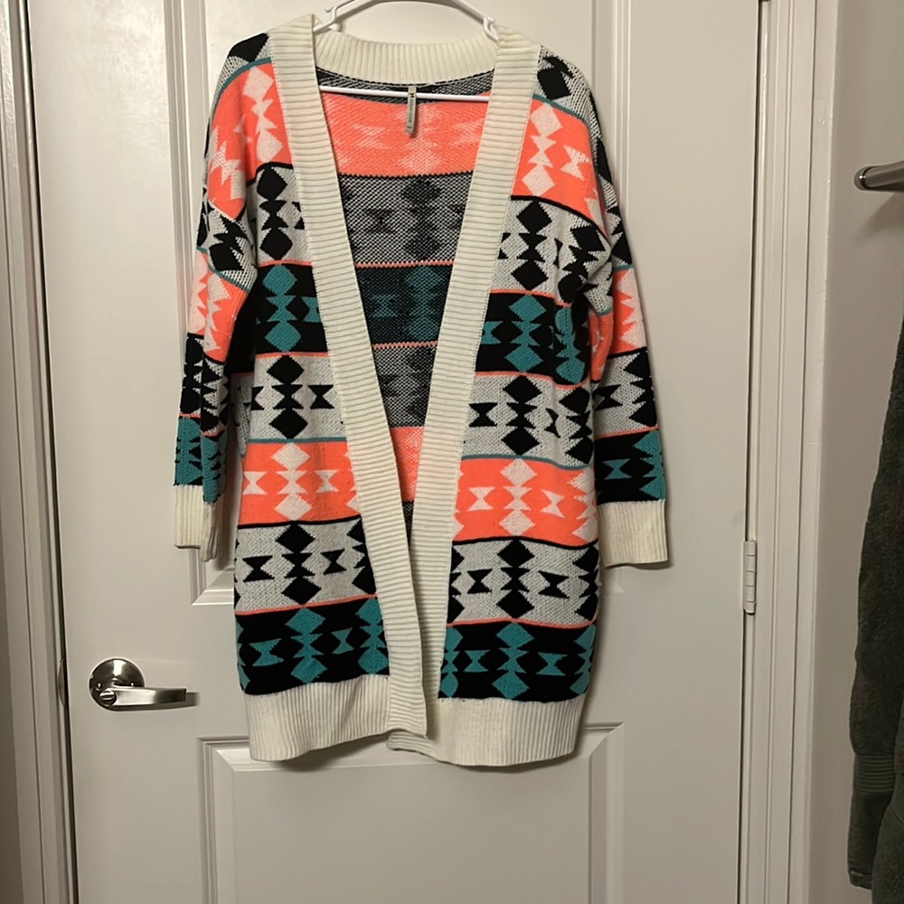 A long bright colored sweater cardigan
